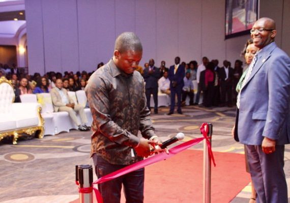 Prophet Shepherd Bushiri cutting the ribbon to launch ECG in Washington DC. Standing by Major 1 is Pastor Brian Ngambi, the National Pastor and Coordinator of ECG Ministries in America and his wife Priscilla Ngambi.